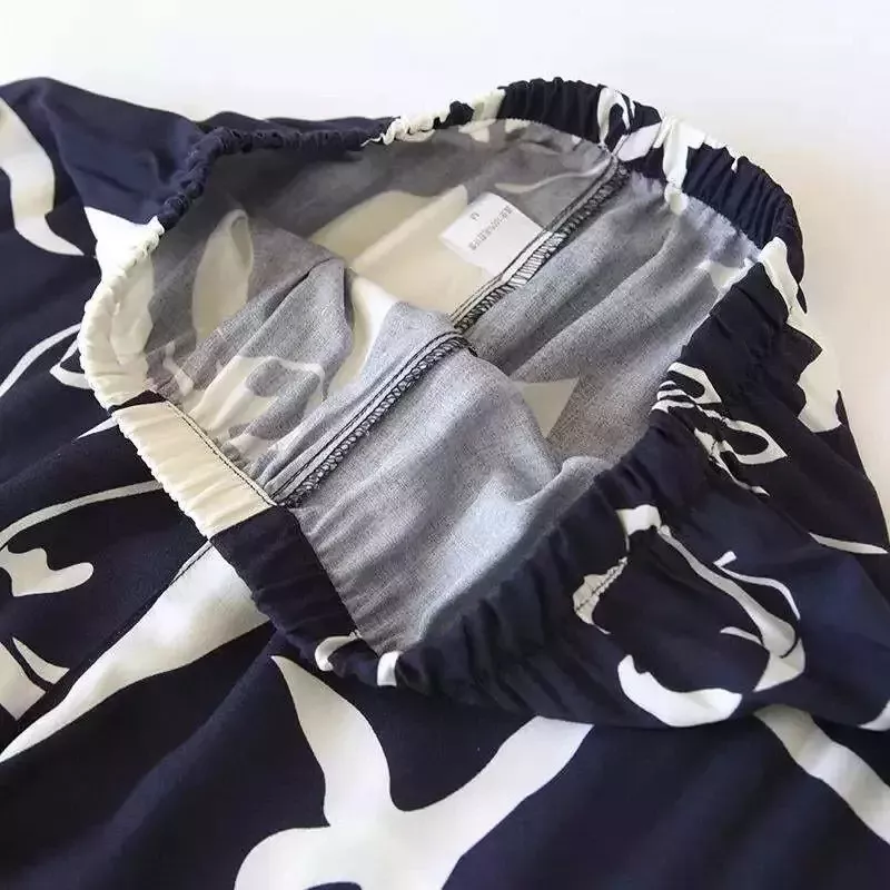 Pyjama satin bleu marine et blanc